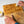Load image into Gallery viewer, Before and after using Renapur Beeswax Wood Polish on an old chopping board, showing revived wood colour and smooth finish.