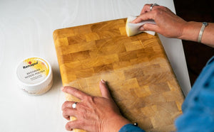 Before and after using Renapur Beeswax Wood Polish on an old chopping board, showing revived wood colour and smooth finish.