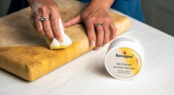 Applying Renapur Beeswax Wood Polish with an Application Sponge for even coverage and nourishment.