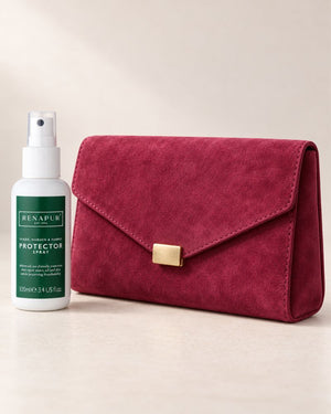 Renapur 100ml Protector Spray beside a berry-coloured suede clutch bag.