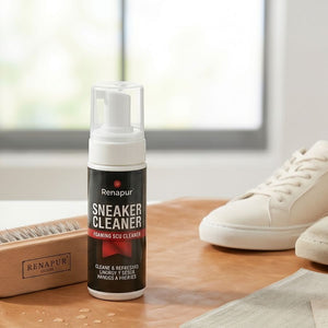 Renapur Sneaker Cleaner beside a wooden Renapur brush and white trainers on a kitchen worktop.