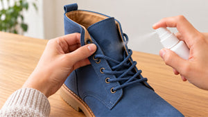 Testing protector on a concealed area of the tongue of a blue suede boot.
